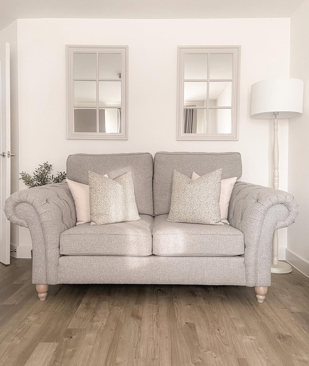A Cottage Sofa and Two Grid Mirrors