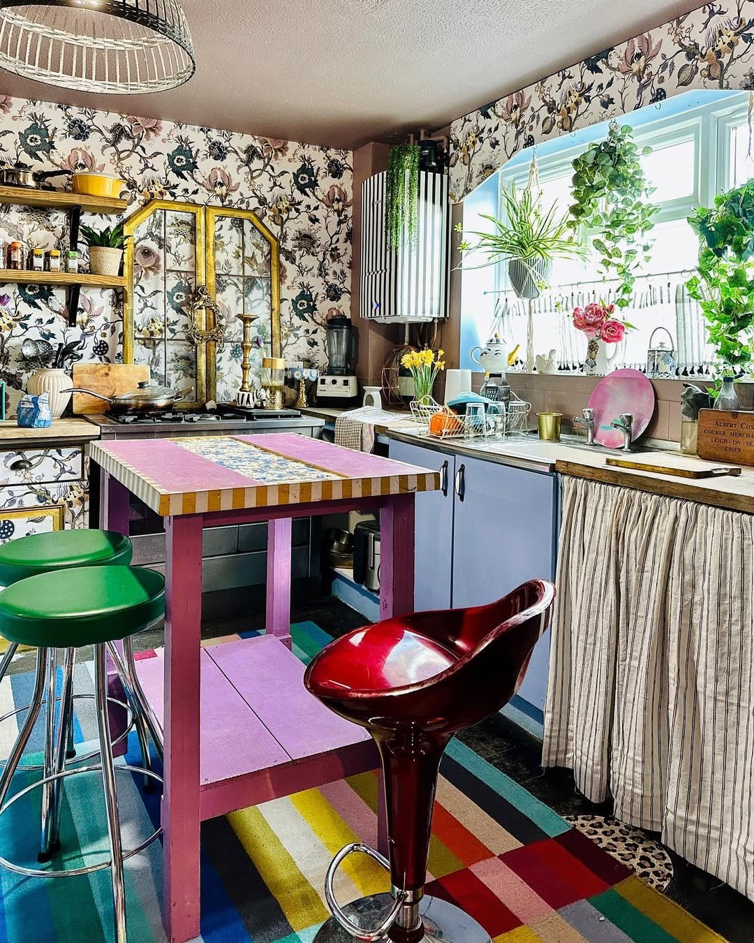 A sage kitchen with brass details