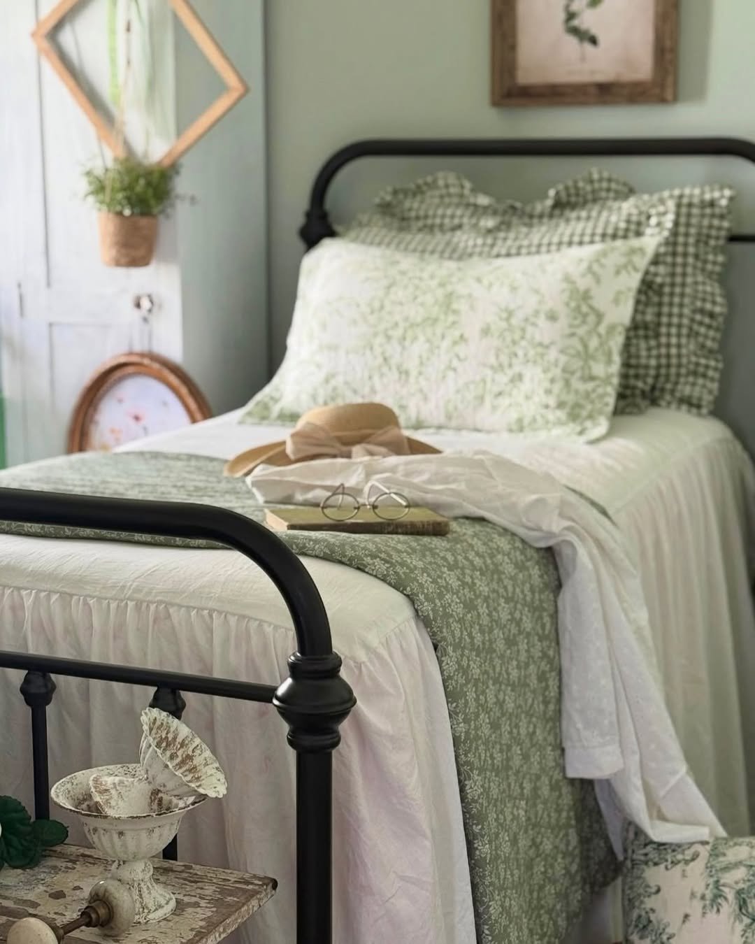 Black Wrought Iron Bed in a Sage Bedroom