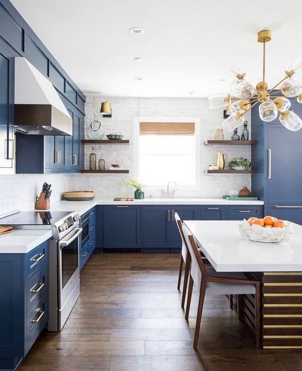 Cobalt Cabinets in a Brass Eat-In Kitchen
