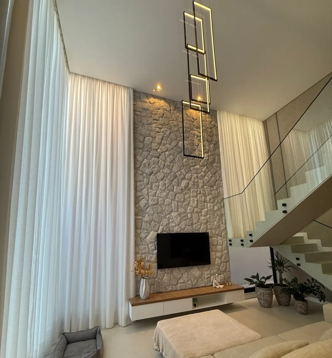 Double-Height Gray Cobblestone TV Wall