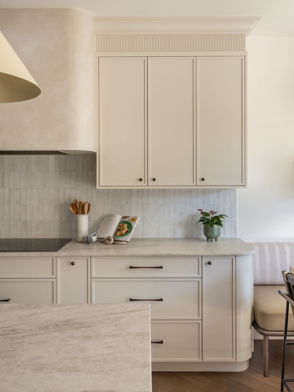 Kitchen with Cream Hood and Vertical Tile