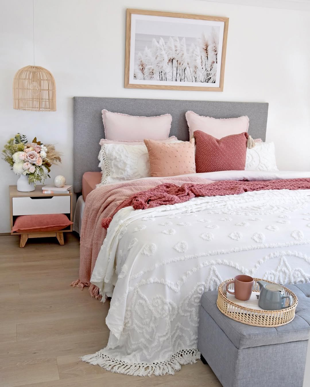 Layered Rattan and Rose Coastal Bedroom
