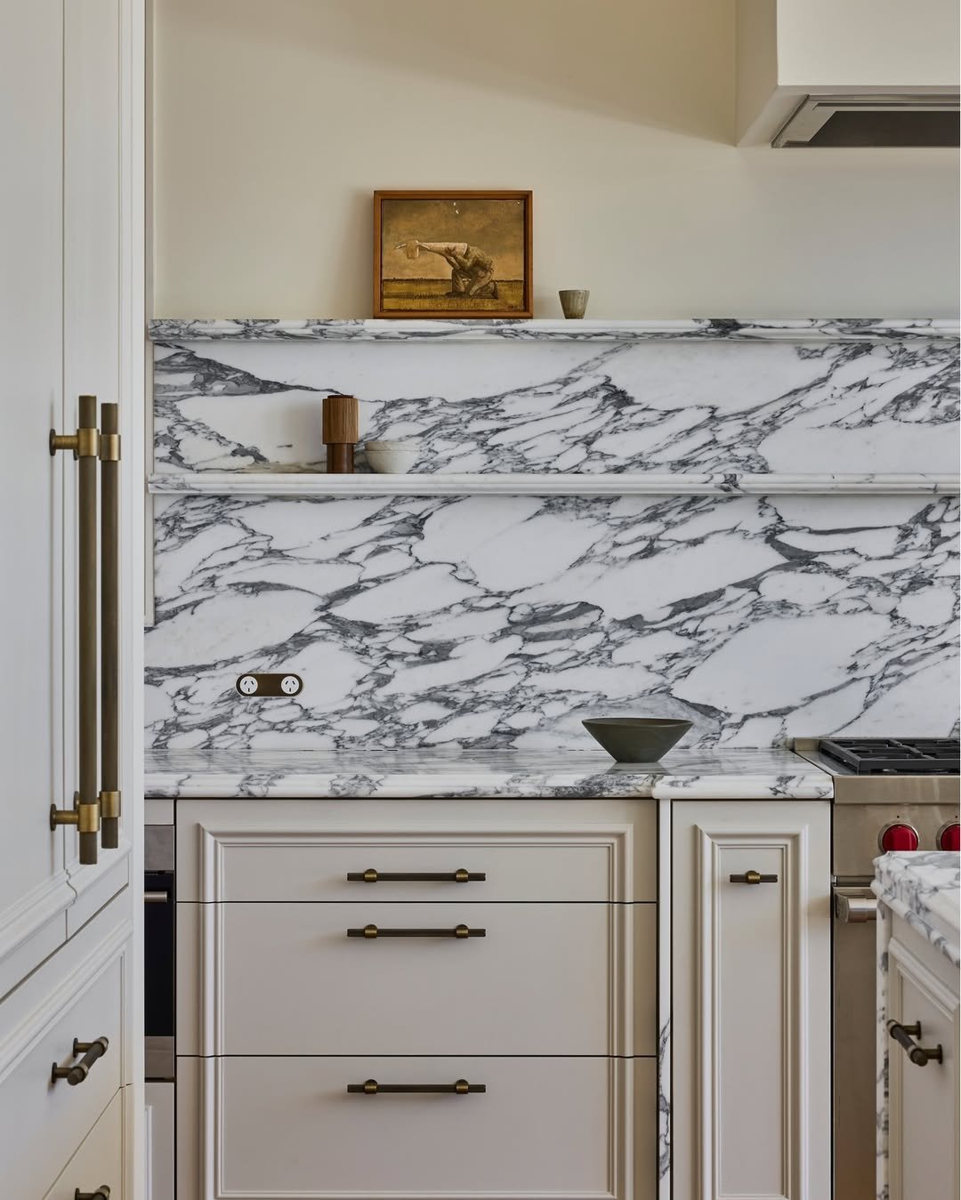Marble Slab Backsplash with Brass Pulls