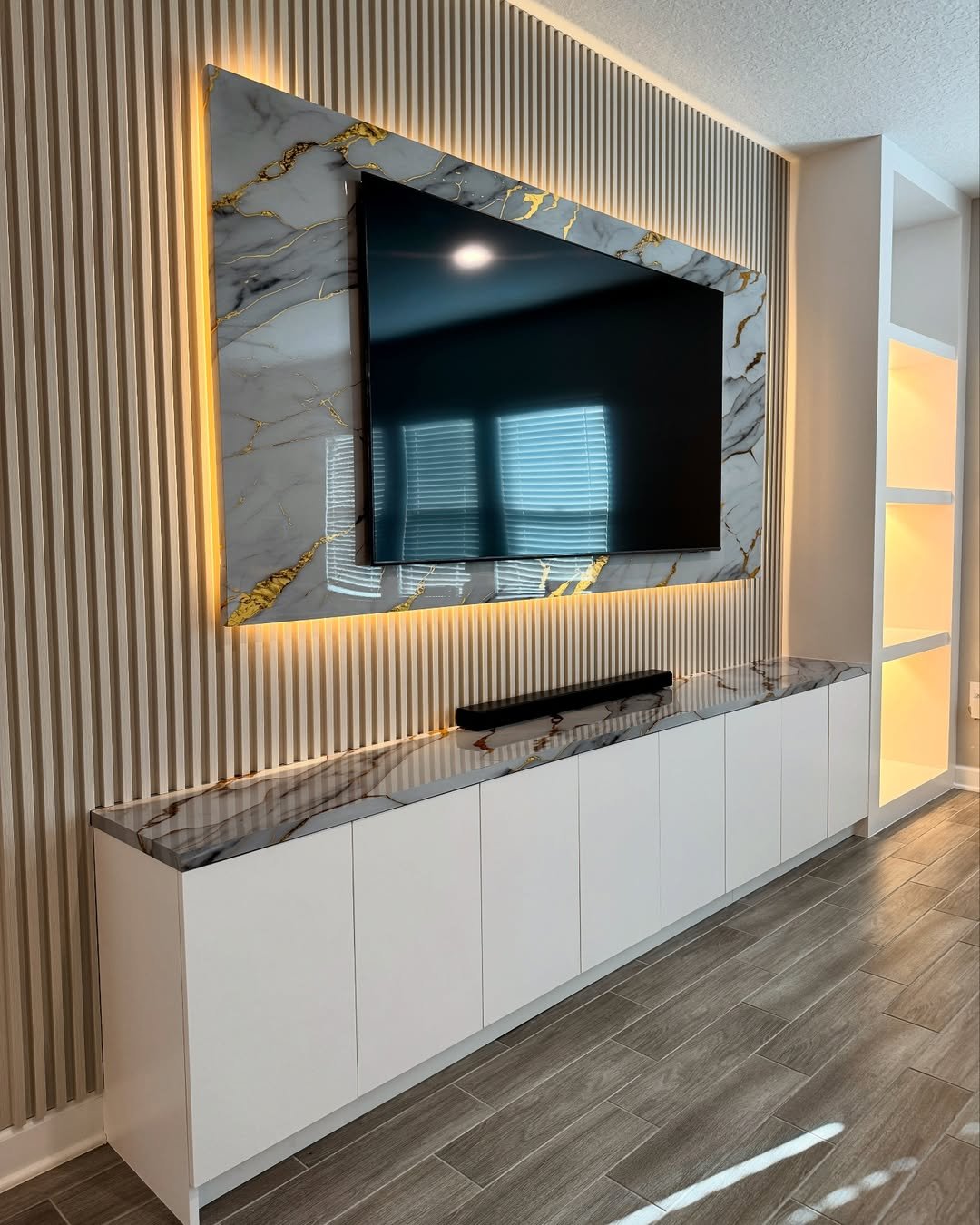 Marble TV Wall with Gold Accents