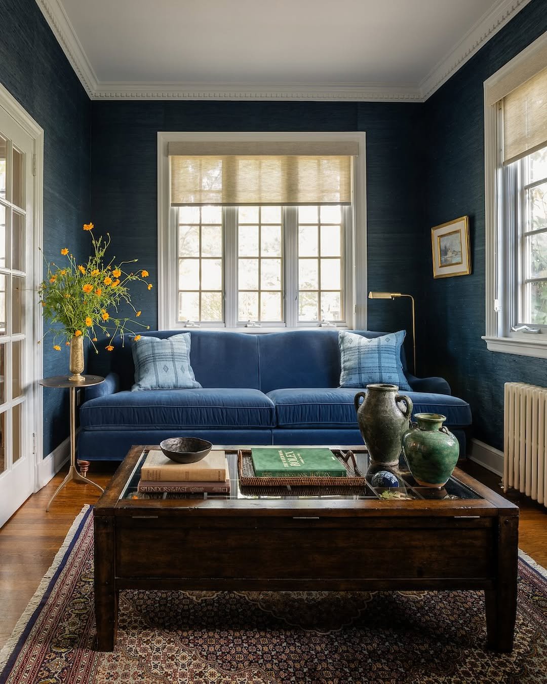 Navy Grasscloth Walls and Blue Sofa