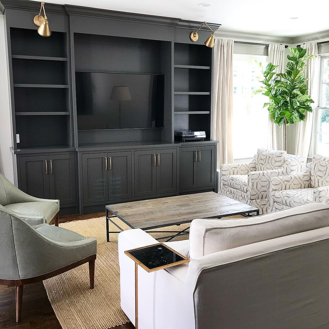 Nearly Black Built-In Cabinetry and Brass Pulls