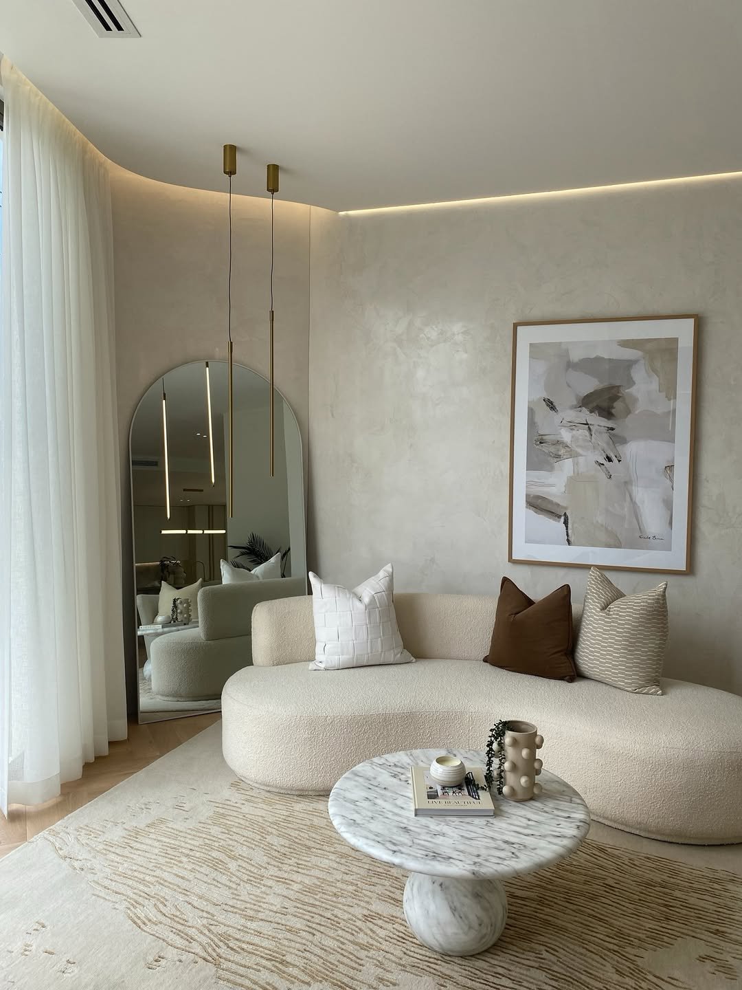 Oyster White Plaster Wall with Brass Pendants