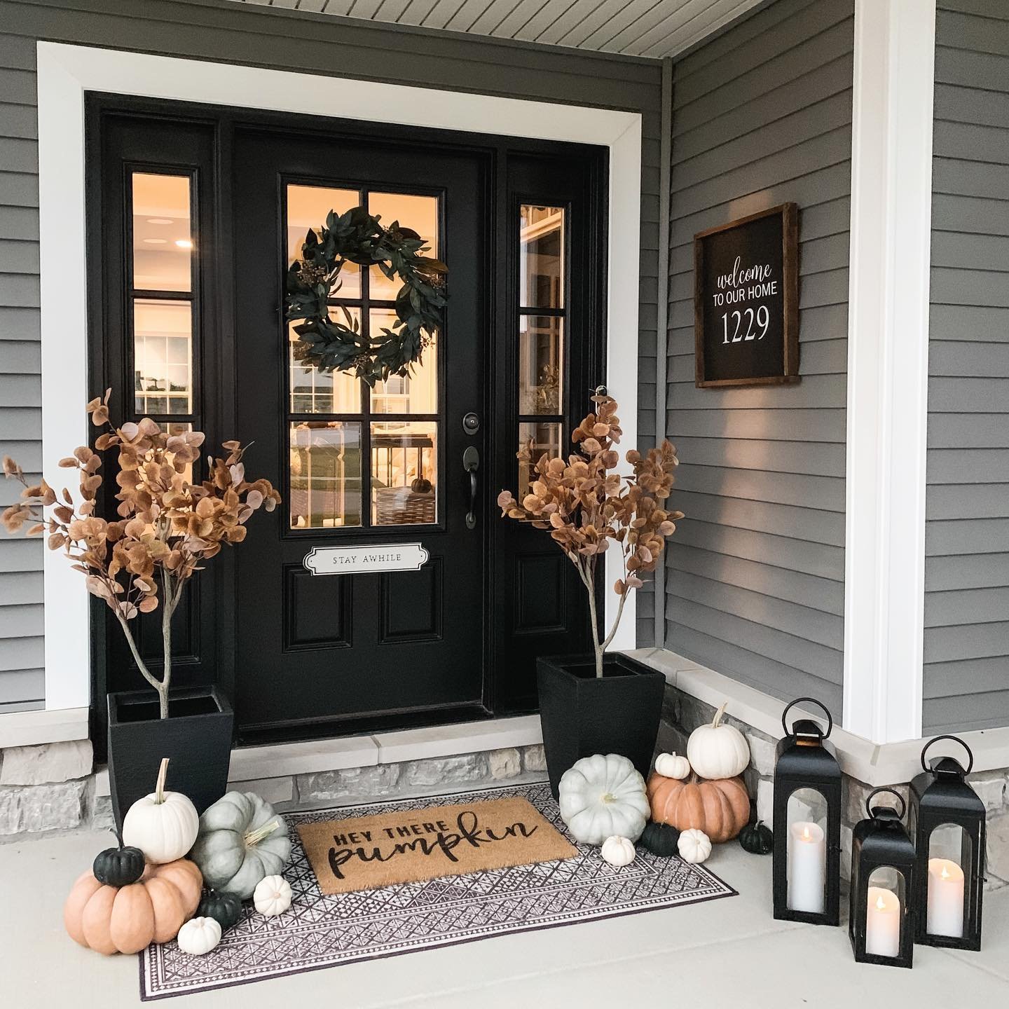 Three Pumpkins at a Dark Door
