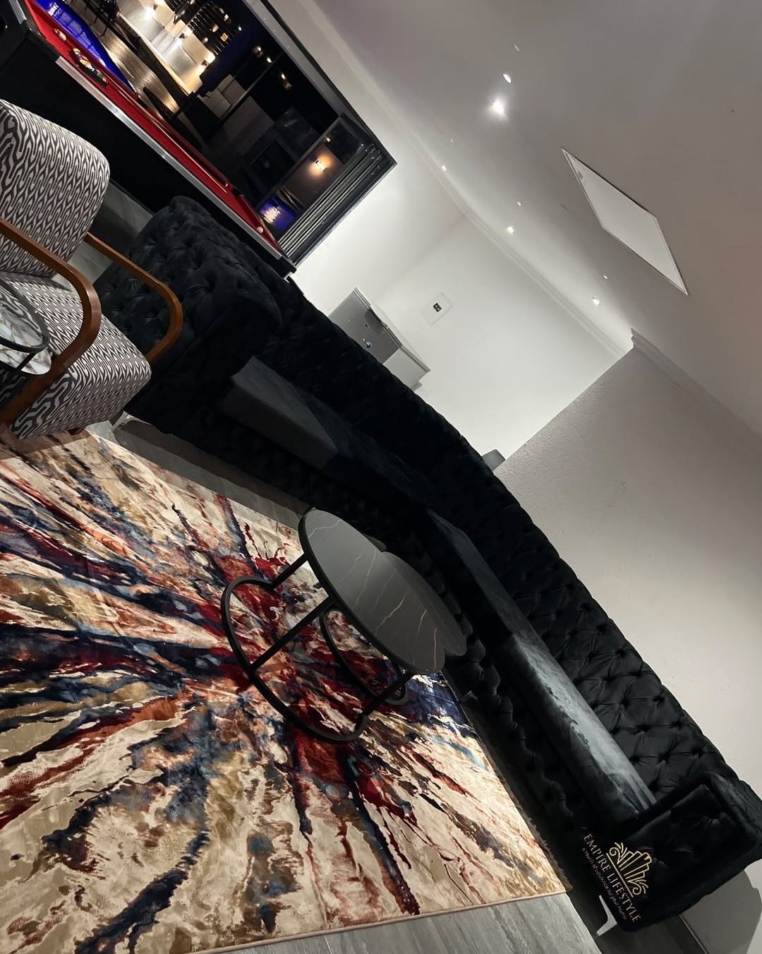 Tufted Sofa with Abstract Rug
