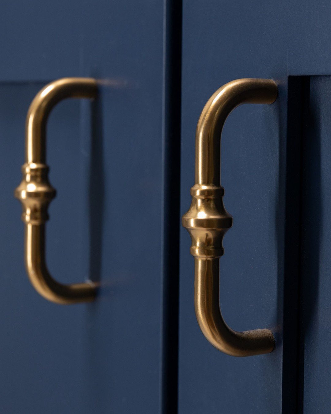Turned Base Pulls for Navy Cabinet Doors