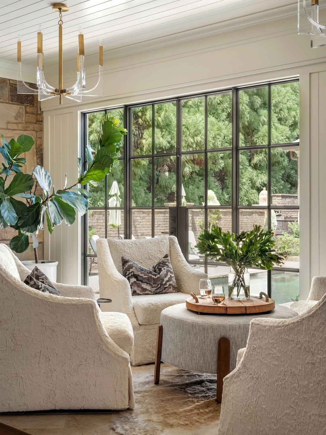 Two Cream Plaster-Textured Swivel Chairs with Round Ottoman