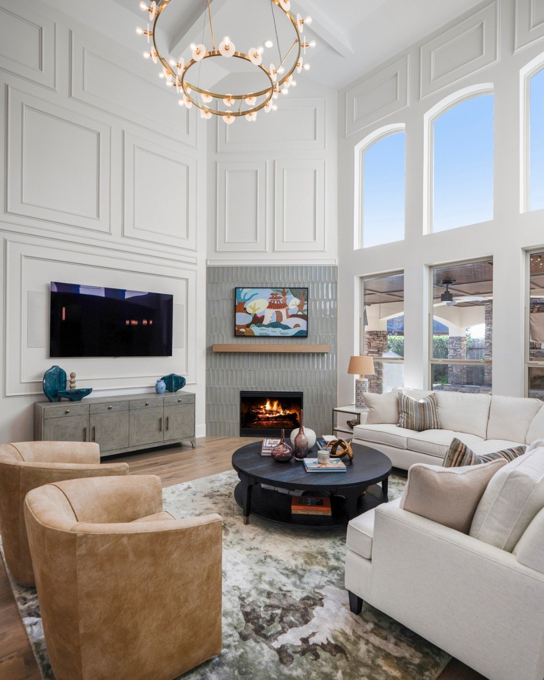 Two-Storey TV Wall with Teal Tile Fireplace