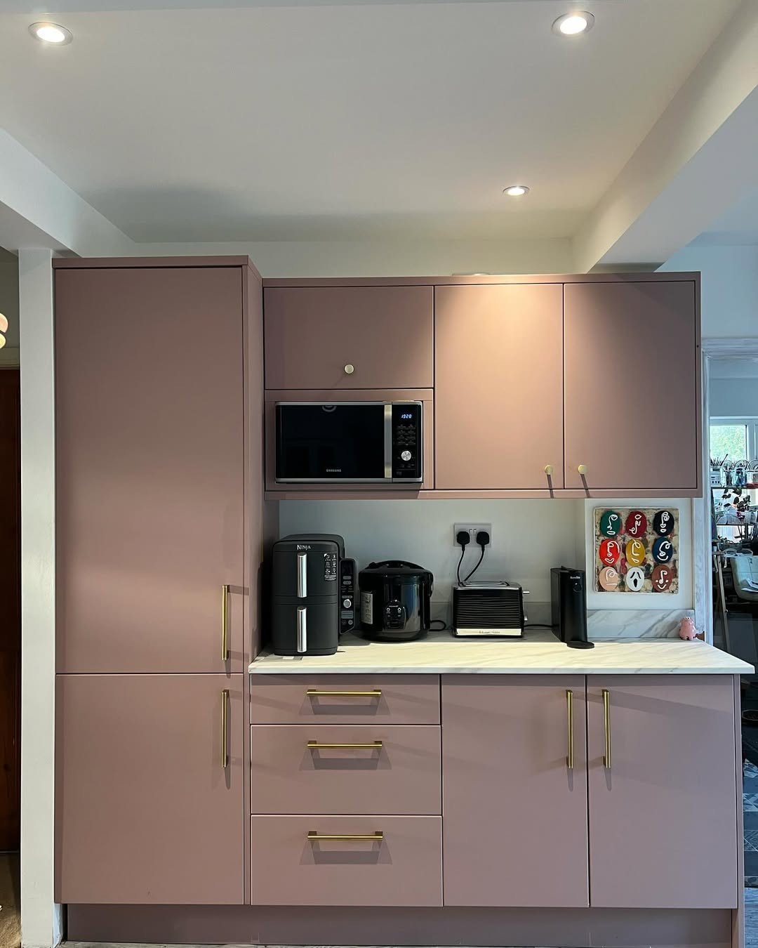 Warm Grey Shaker Cabinets with White Countertops