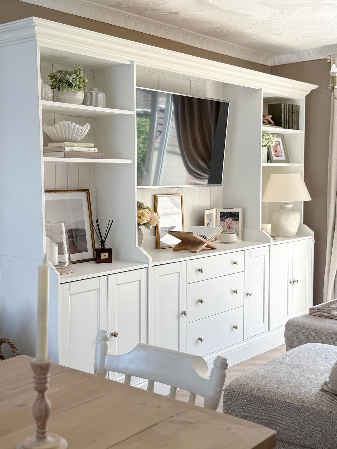 White Built-In Display Cabinet with Stepped Open Shelving and Shaker Storage
