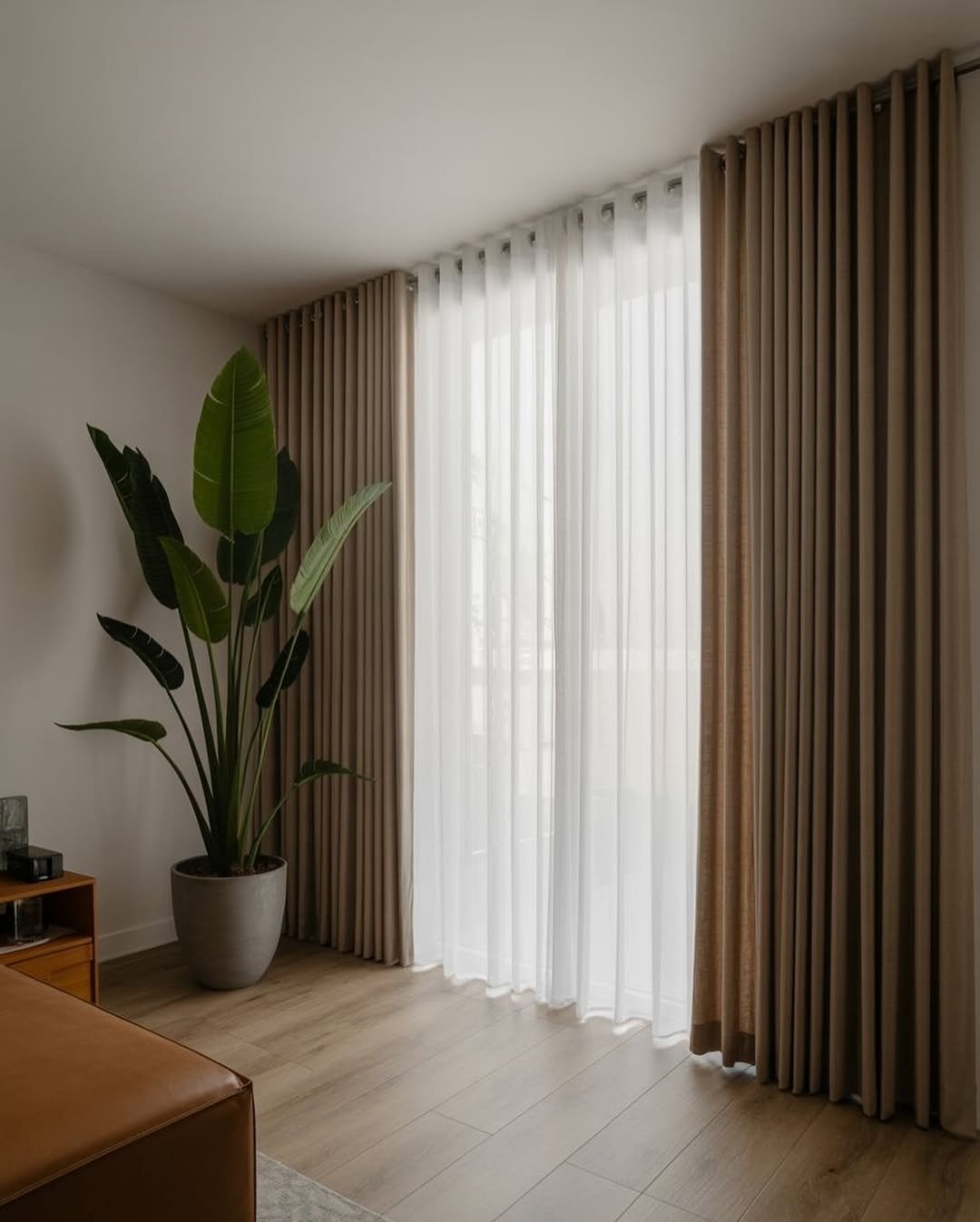 White Inner and Tan Outer Corner Curtains on One Shared Track