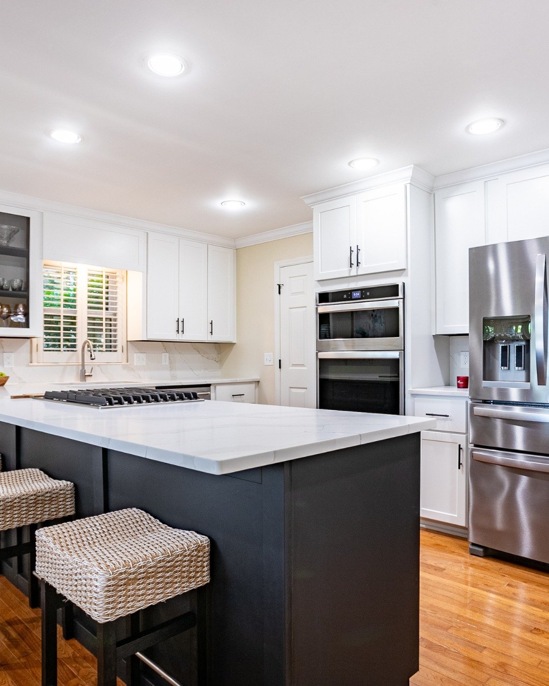 White Shaker Cabinets with a Dark Island