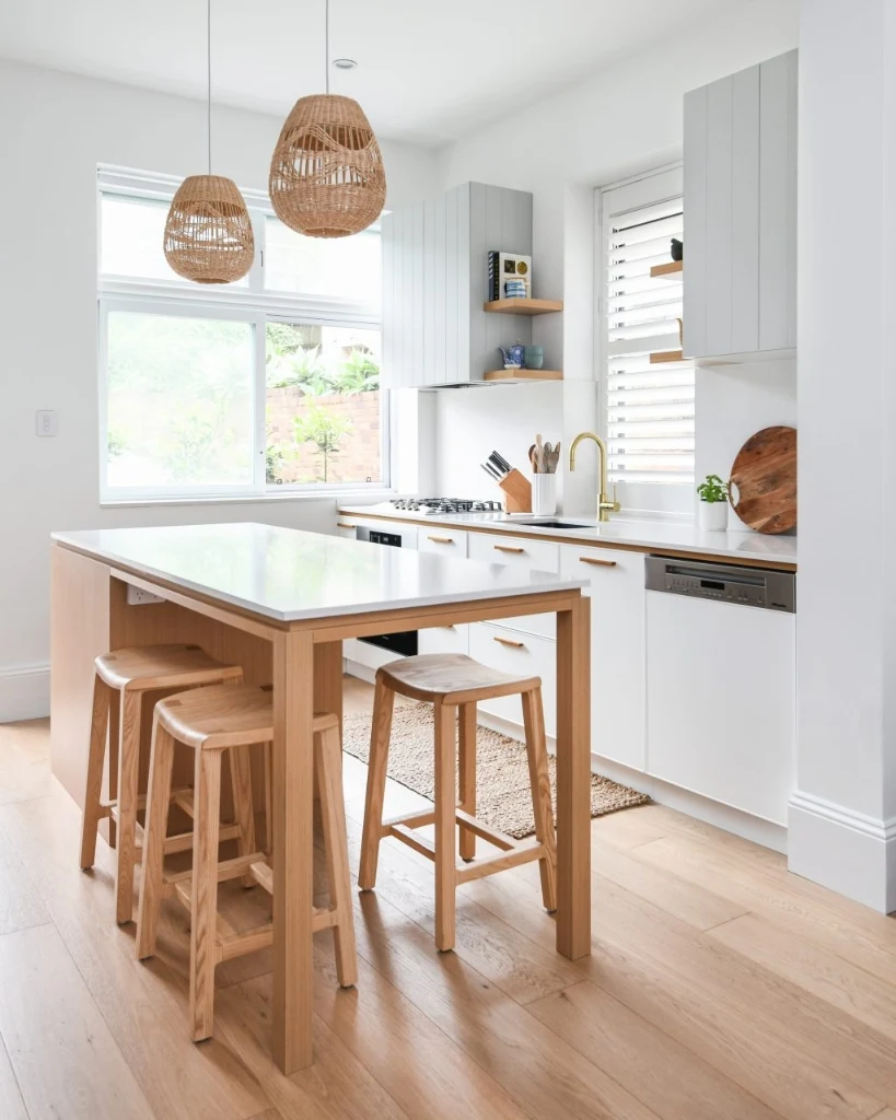White-Top Wood-Leg Island with Two Woven Rattan Pendants
